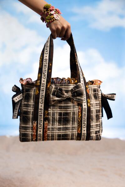 A model showcasing Hand Bag collection