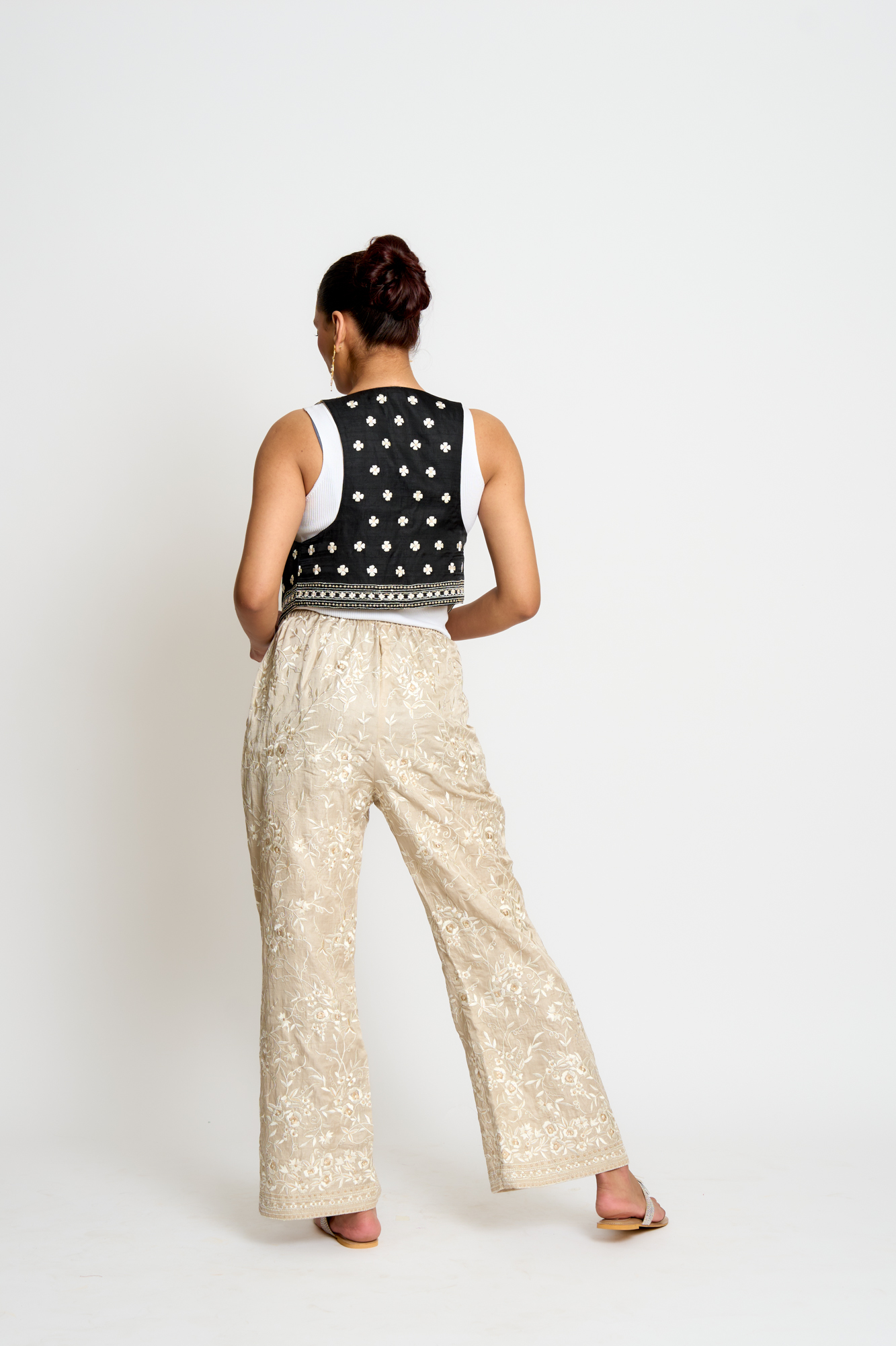 A model showcasing Beige And Black Kalki Reversible Waistcoat by Ashtar from Ashtar's collection