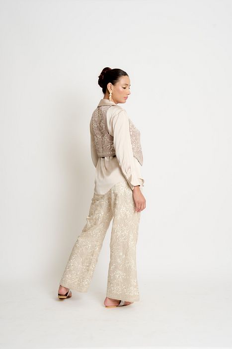 A model showcasing Khaki And Taupe Kalki Reversible Waistcoat by Ashtar from Ashtar's collection