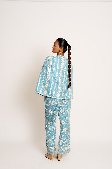 A model showcasing Teapot Blue Giro Cape by Ashtar from Ashtar's collection