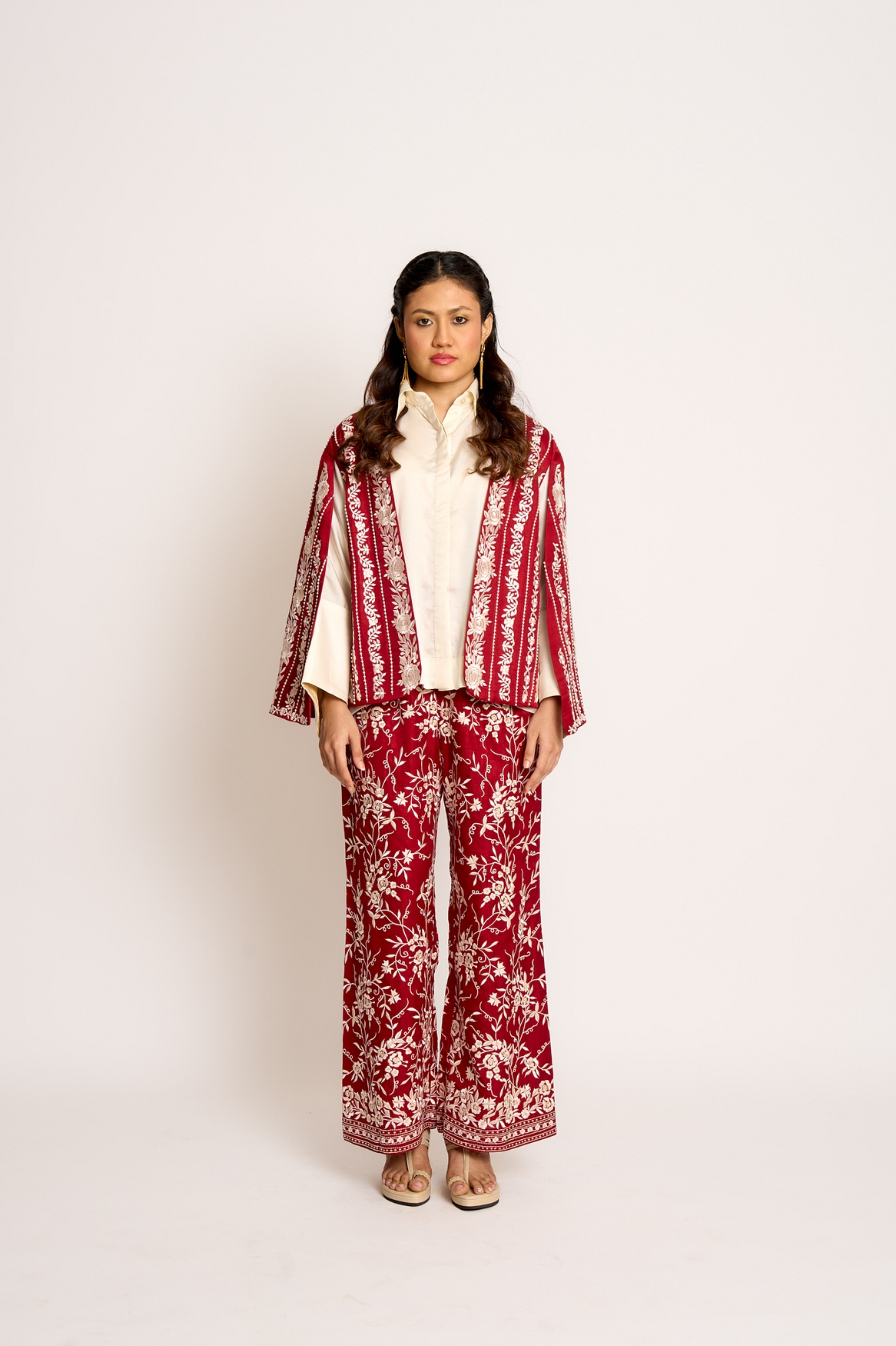 A model showcasing Cherry Red Giro Cape And Pants Set Feature image by Ashtar from Ashtar's collection