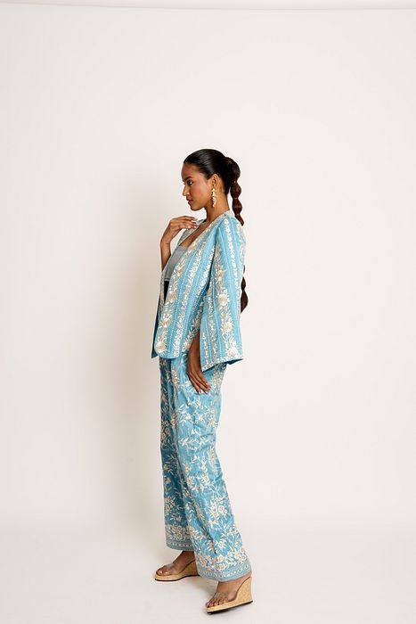 A model showcasing Teapot Blue Giro Cape And Pants Set by Ashtar from Ashtar's collection