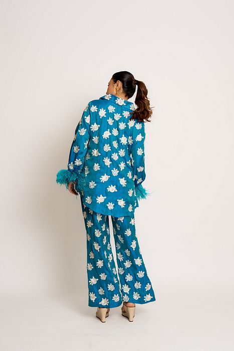 A model showcasing Peacock Blue Shehnaaz Twin Set by Ashtar from Ashtar's collection A model showcasing Peacock Blue Shehnaaz Twin Set by Ashtar from Ashtar's collection
