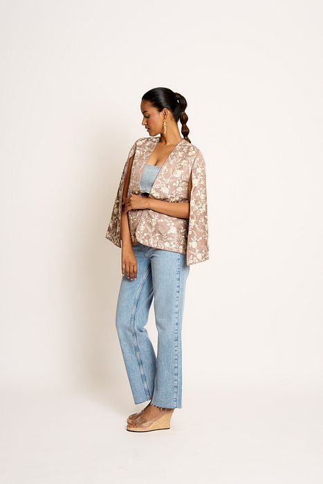 A model showcasing Taupe Grey Naina Cape by Ashtar from Ashtar's collection