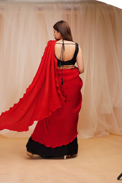 A model showcasing Candy Red Jet Black Ready To Wear Drape Saree by Farha Syed from Farha Syed's collection
