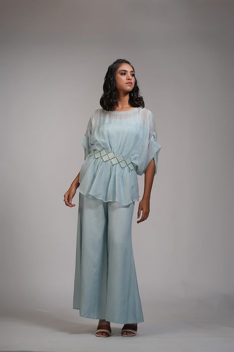 A model showcasing Powder Blue Organza Coord Set With Embroidered Belt by Shruti S Label from Shruti S Label's collection
