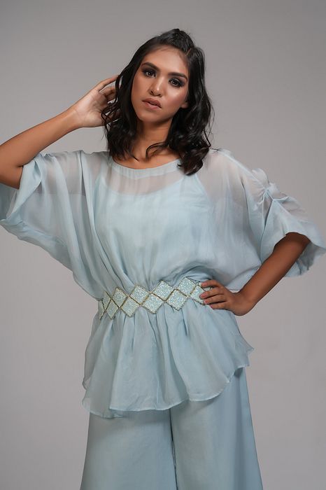 A model showcasing Powder Blue Organza Coord Set With Embroidered Belt by Shruti S Label from Shruti S Label's collection