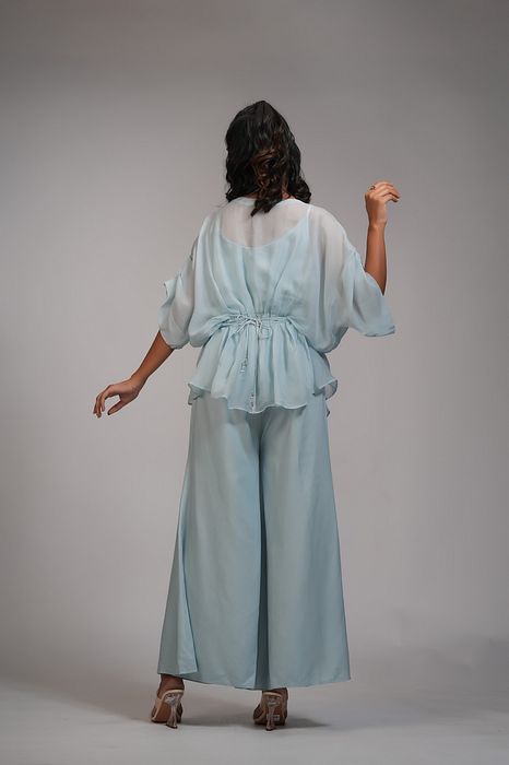 A model showcasing Powder Blue Organza Coord Set With Embroidered Belt by Shruti S Label from Shruti S Label's collection