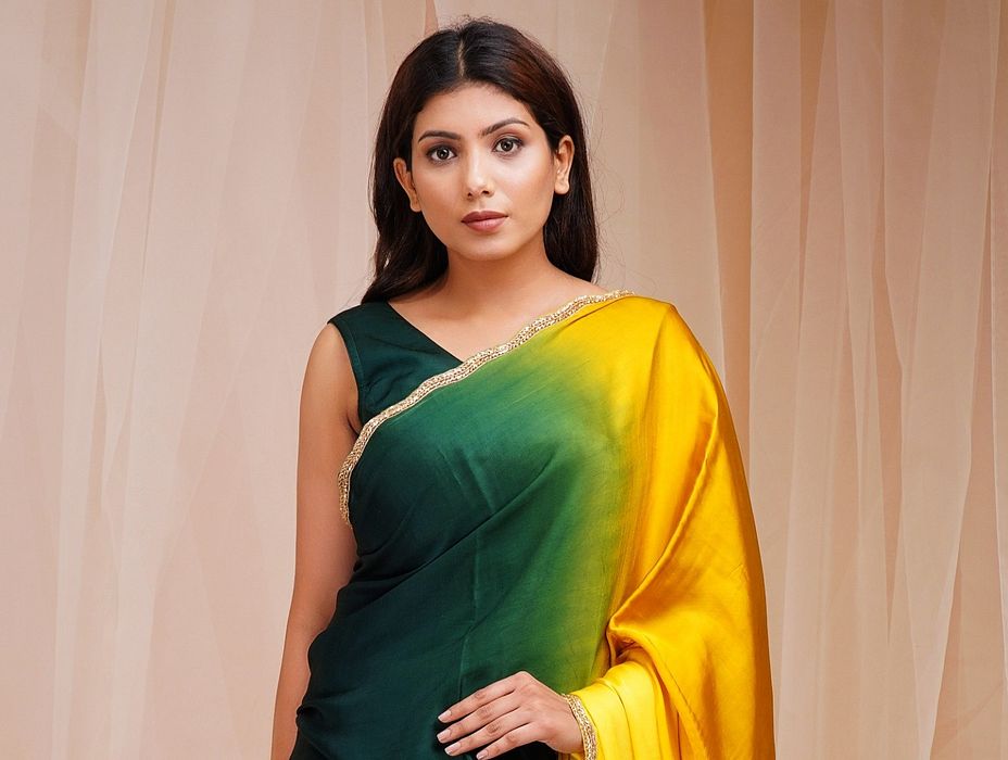 A model showcasing Green And Yellow 4D Dyed Saree by Farha Syed from Farha Syed's collection A model showcasing Green And Yellow 4D Dyed Saree by Farha Syed from Farha Syed's collection