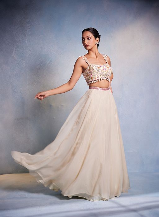 A model showcasing Shankha Lehenga by Muditaa By Urmila from Muditaa By Urmila's collection
