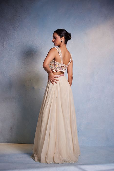 A model showcasing Shankha Lehenga by Muditaa By Urmila from Muditaa By Urmila's collection