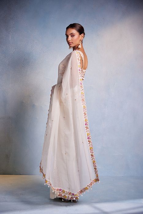 A model showcasing Shankha Saree by Muditaa By Urmila from Muditaa By Urmila's collection