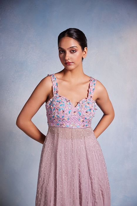 A model showcasing Itisha Peplum And Sharara Set by Muditaa By Urmila from Muditaa By Urmila's collection