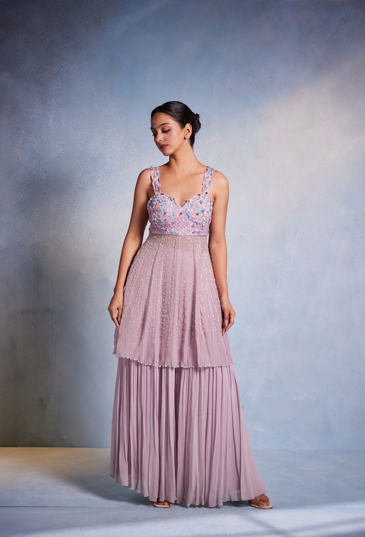 A model showcasing Itisha Peplum And Sharara Set Feature image by Muditaa By Urmila from Muditaa By Urmila's collection