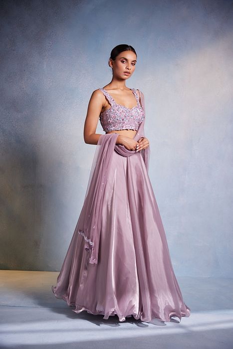 A model showcasing Itisha Lehenga by Muditaa By Urmila from Muditaa By Urmila's collection
