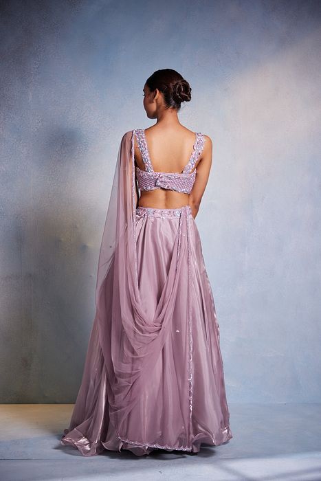 A model showcasing Itisha Lehenga by Muditaa By Urmila from Muditaa By Urmila's collection