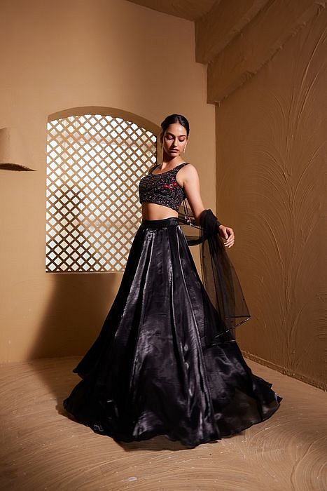 A model showcasing Qainaat Lehenga by Muditaa By Urmila from Muditaa By Urmila's collection
