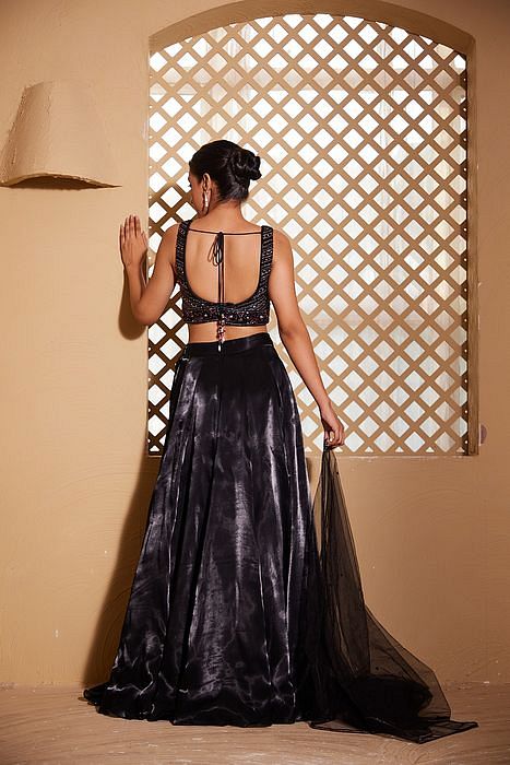 A model showcasing Qainaat Lehenga by Muditaa By Urmila from Muditaa By Urmila's collection