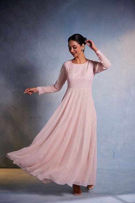A model showcasing Aamani Dress by Muditaa By Urmila from Muditaa By Urmila's collection