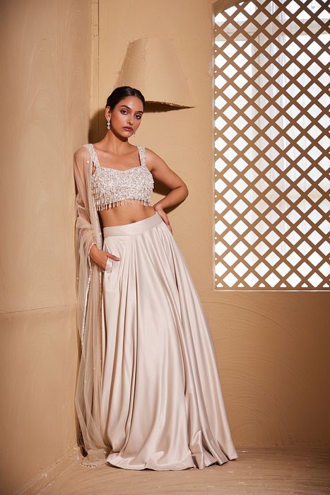 A model showcasing Hansika Lehenga by Muditaa By Urmila from Muditaa By Urmila's collection