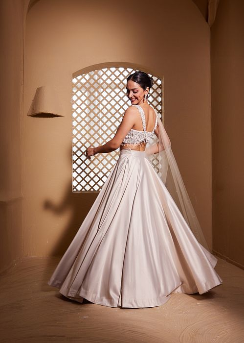 A model showcasing Hansika Lehenga by Muditaa By Urmila from Muditaa By Urmila's collection
