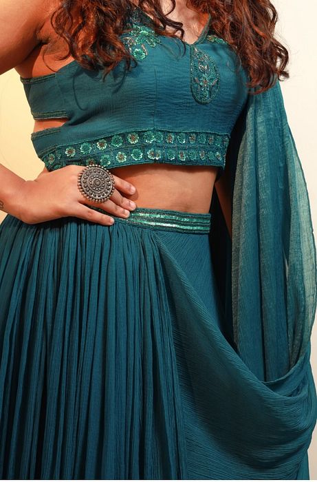 A model showcasing Raine Saree by Muditaa By Urmila from Muditaa By Urmila's collection