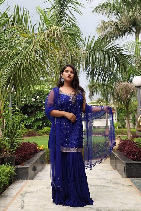 A model showcasing Akasa Gharara Set by Muditaa By Urmila from Muditaa By Urmila's collection