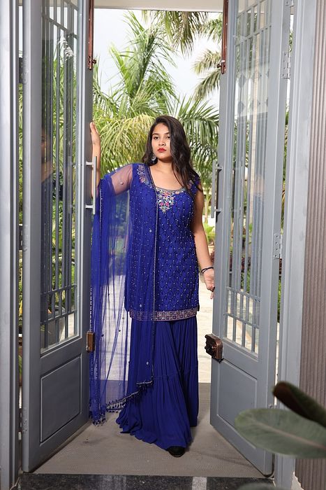 A model showcasing Akasa Gharara Set by Muditaa By Urmila from Muditaa By Urmila's collection