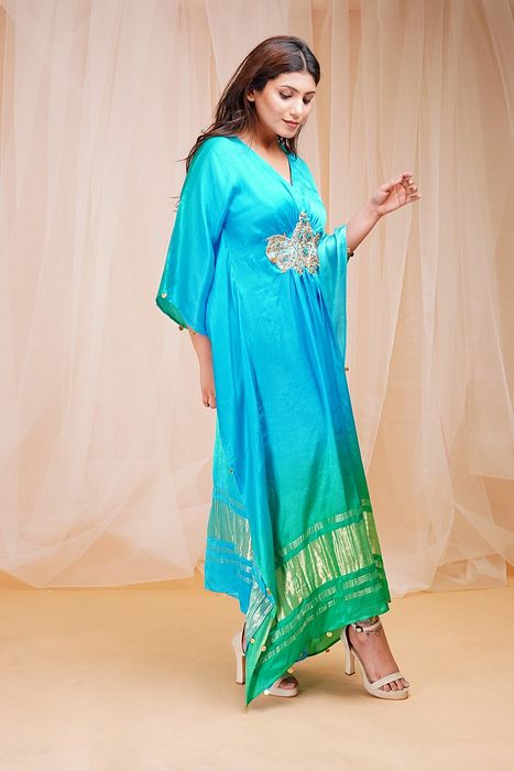 A model showcasing Bright Green Coral Blue Kaftaan by Farha Syed from Farha Syed's collection A model showcasing Bright Green Coral Blue Kaftaan by Farha Syed from Farha Syed's collection