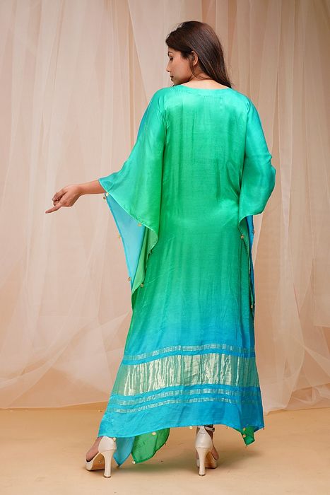 A model showcasing Bright Green Coral Blue Kaftaan by Farha Syed from Farha Syed's collection A model showcasing Bright Green Coral Blue Kaftaan by Farha Syed from Farha Syed's collection