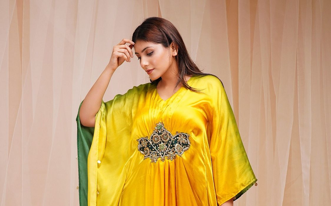A model showcasing Bright Yellow Golf Green Shaded Kaftaan by Farha Syed from Farha Syed's collection A model showcasing Bright Yellow Golf Green Shaded Kaftaan by Farha Syed from Farha Syed's collection