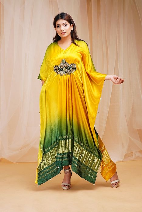 A model showcasing Bright Yellow Golf Green Shaded Kaftaan by Farha Syed from Farha Syed's collection A model showcasing Bright Yellow Golf Green Shaded Kaftaan by Farha Syed from Farha Syed's collection