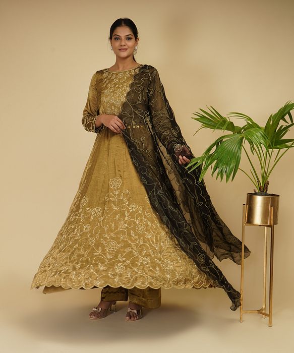 A model showcasing 2 Piece Golden Anarkali With Dupatta by Farha Syed from Farha Syed's collection