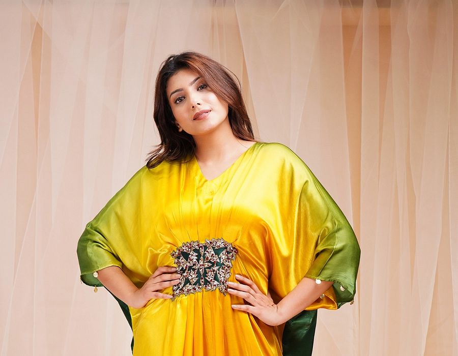 A model showcasing Bright Yellow Golf Green Kaftaan by Farha Syed from Farha Syed's collection A model showcasing Bright Yellow Golf Green Kaftaan by Farha Syed from Farha Syed's collection