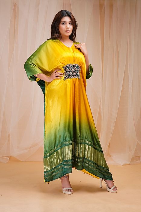 A model showcasing Bright Yellow Golf Green Kaftaan by Farha Syed from Farha Syed's collection A model showcasing Bright Yellow Golf Green Kaftaan by Farha Syed from Farha Syed's collection
