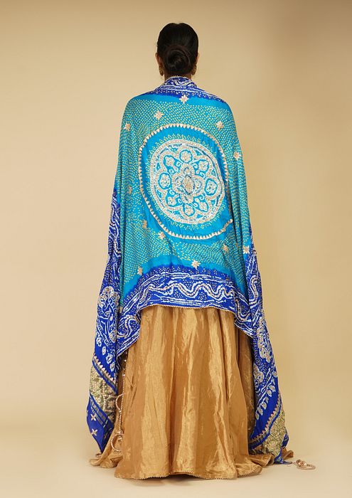 A model showcasing Golden Lehenga Set And Peacock Dupatta by Farha Syed from Farha Syed's collection