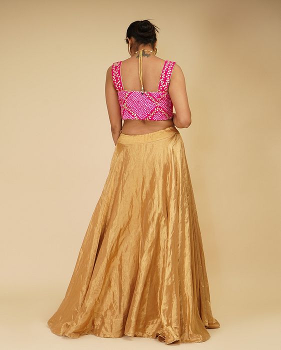 A model showcasing Golden Lehenga Set With Pink Dupatta by Farha Syed from Farha Syed's collection
