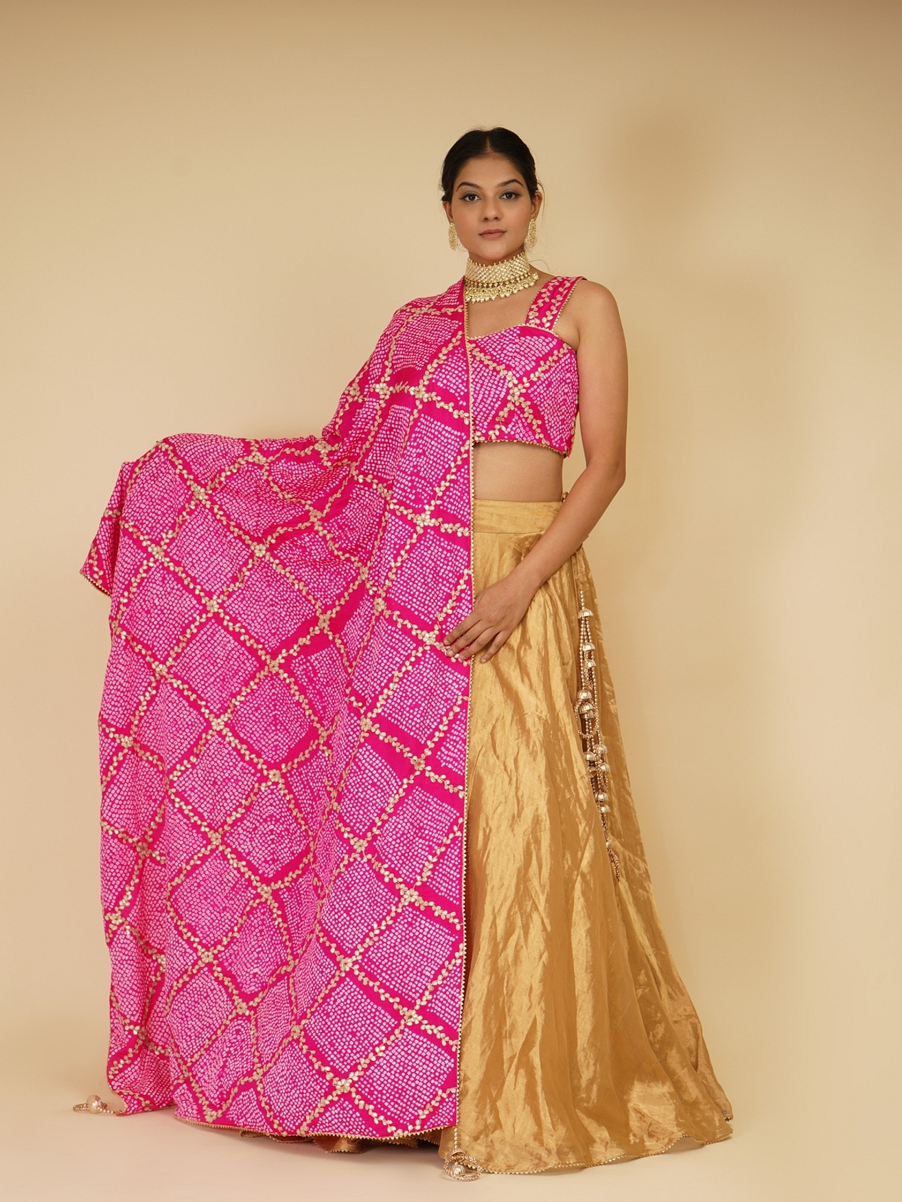 A model showcasing Golden Lehenga Set With Pink Dupatta Feature image by Farha Syed from Farha Syed's collection