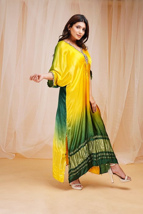 A model showcasing Bright Yellow Golf Green Shaded Kaftan by Farha Syed from Farha Syed's collection A model showcasing Bright Yellow Golf Green Shaded Kaftan by Farha Syed from Farha Syed's collection
