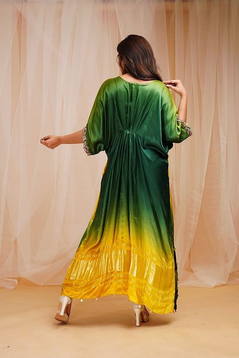 A model showcasing Bright Yellow Golf Green Shaded Kaftan by Farha Syed from Farha Syed's collection A model showcasing Bright Yellow Golf Green Shaded Kaftan by Farha Syed from Farha Syed's collection