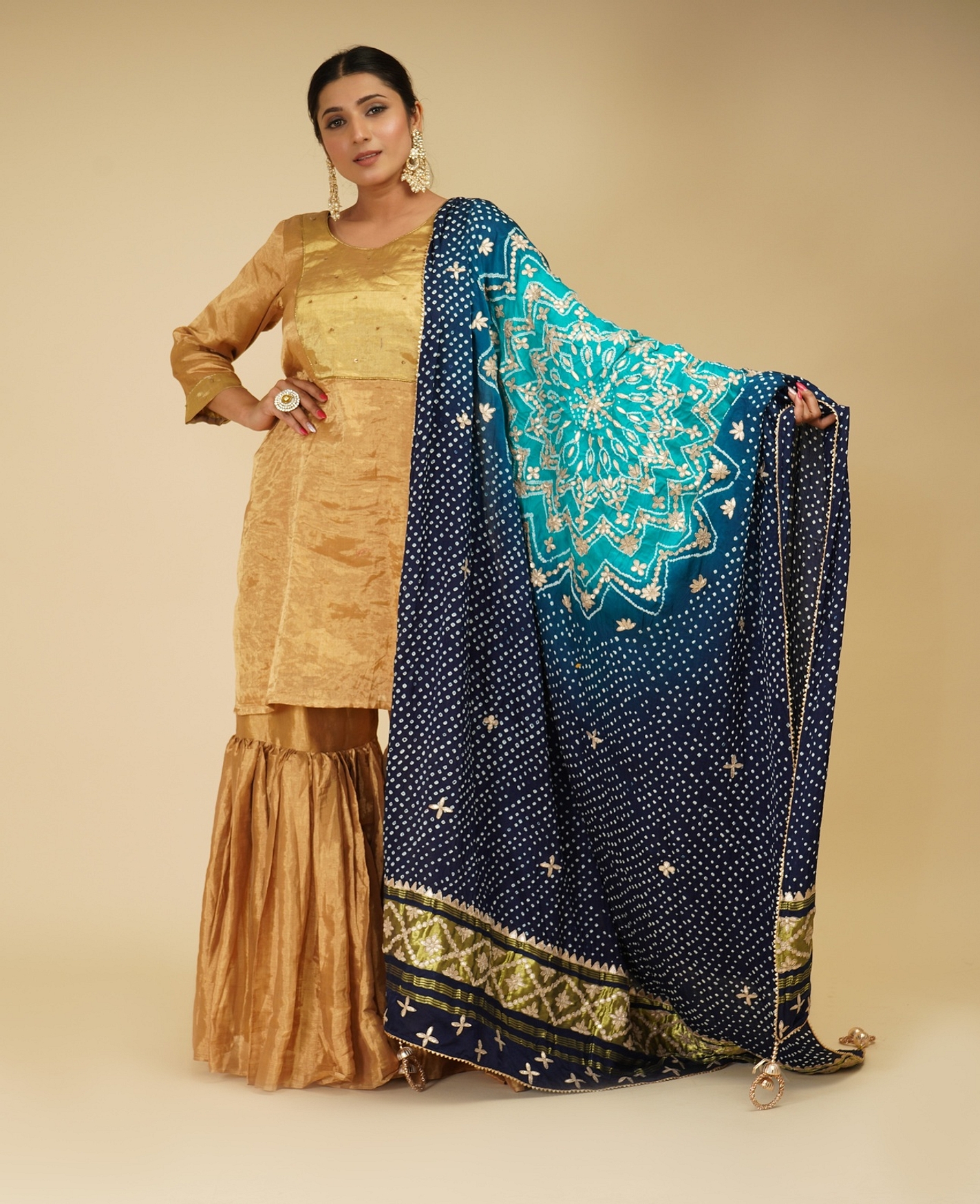A model showcasing Golden Sharara And Peacock Blue Dupatta Feature image by Farha Syed from Farha Syed's collection