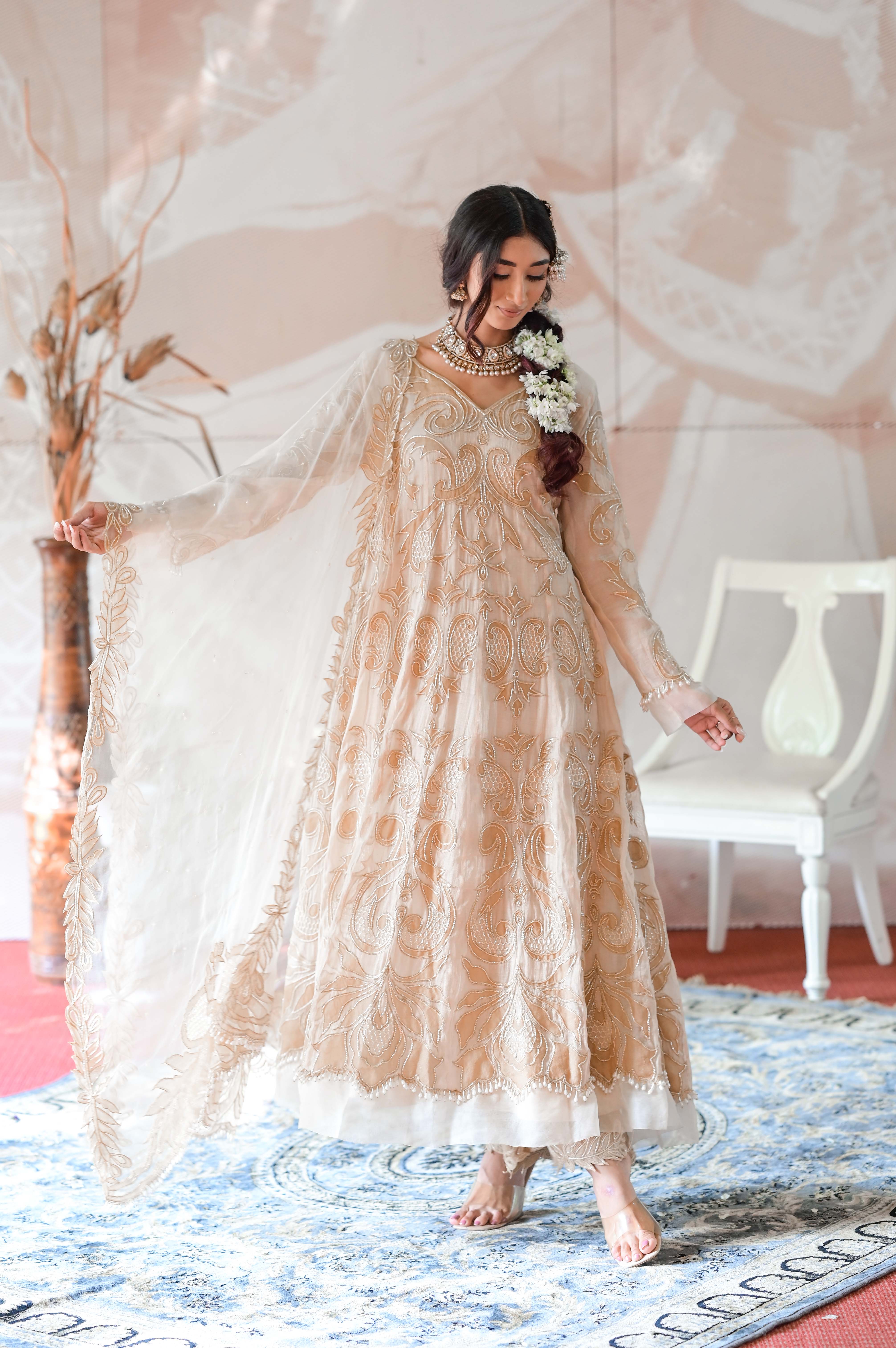 A model showcasing Ivory Beige Anarkali Set by Farha Syed from Farha Syed's collection
