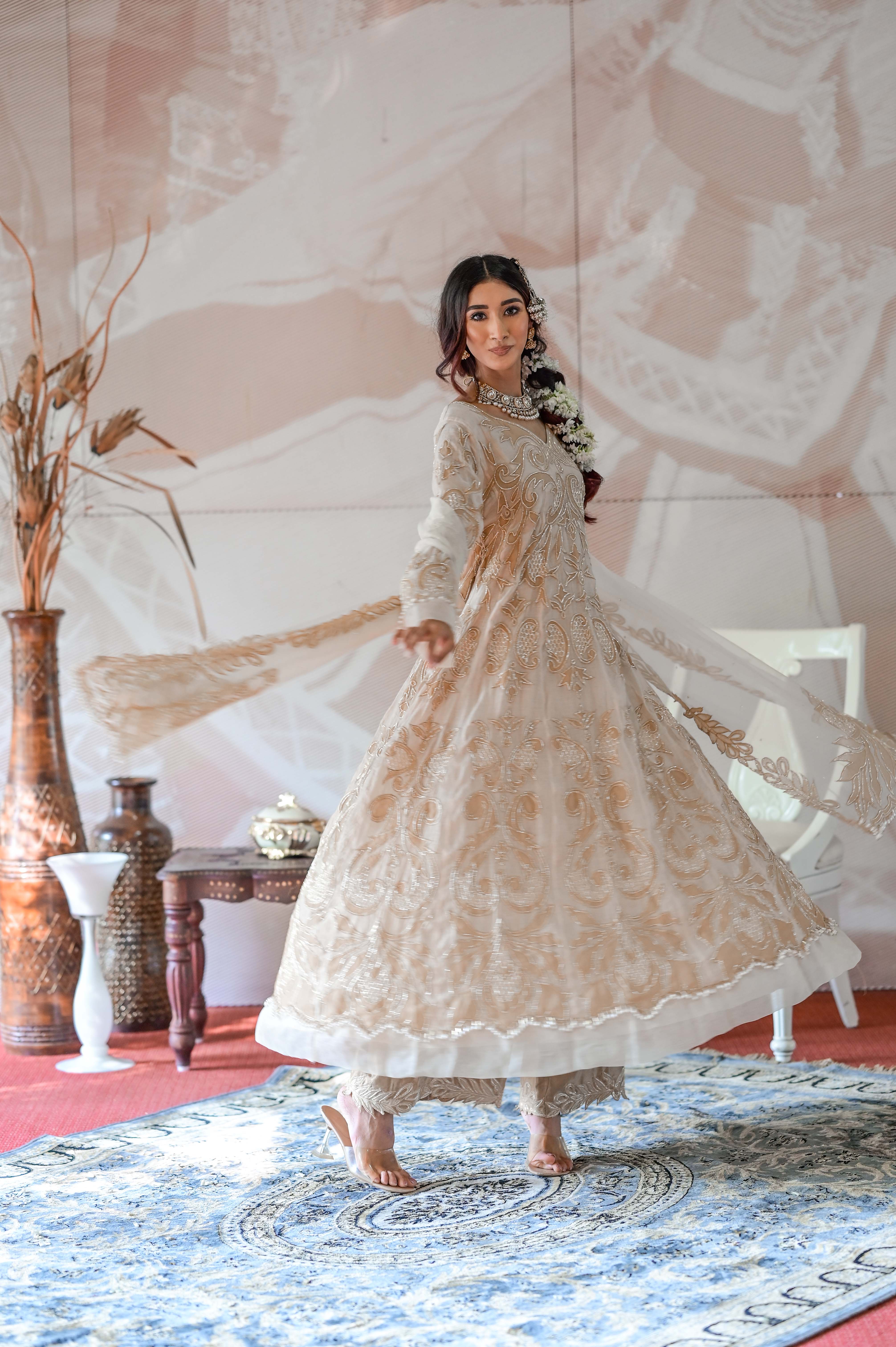 A model showcasing Ivory Beige Anarkali Set by Farha Syed from Farha Syed's collection