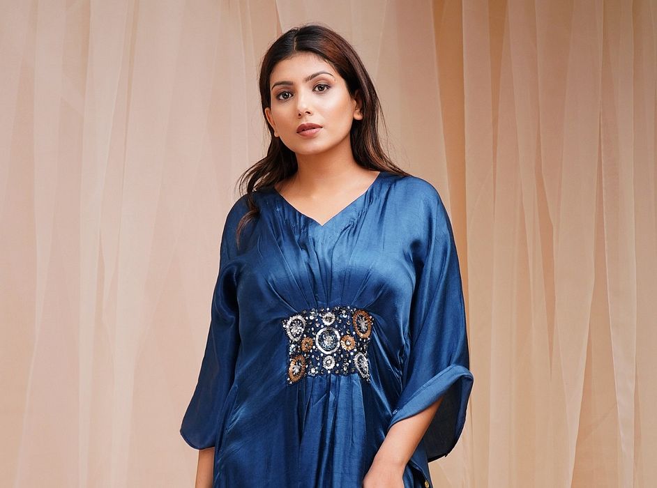 A model showcasing Parrish Blue Kaftaan by Farha Syed from Farha Syed's collection A model showcasing Parrish Blue Kaftaan by Farha Syed from Farha Syed's collection