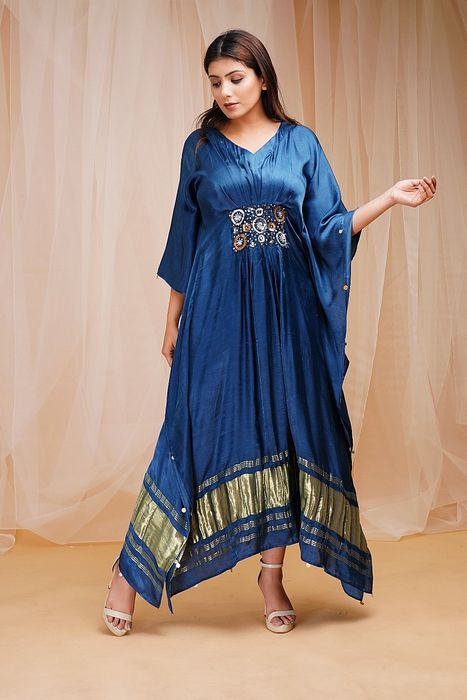A model showcasing Parrish Blue Kaftaan by Farha Syed from Farha Syed's collection A model showcasing Parrish Blue Kaftaan by Farha Syed from Farha Syed's collection