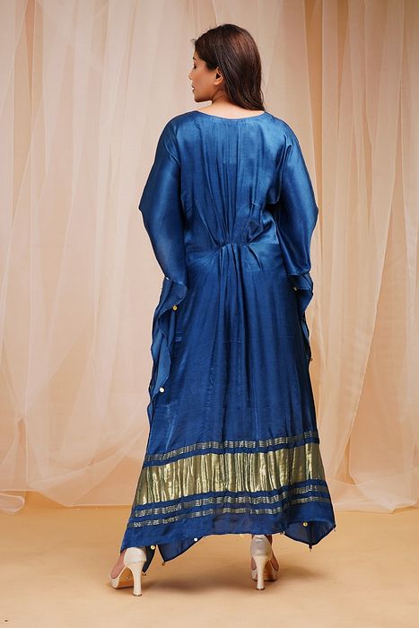 A model showcasing Parrish Blue Kaftaan by Farha Syed from Farha Syed's collection A model showcasing Parrish Blue Kaftaan by Farha Syed from Farha Syed's collection