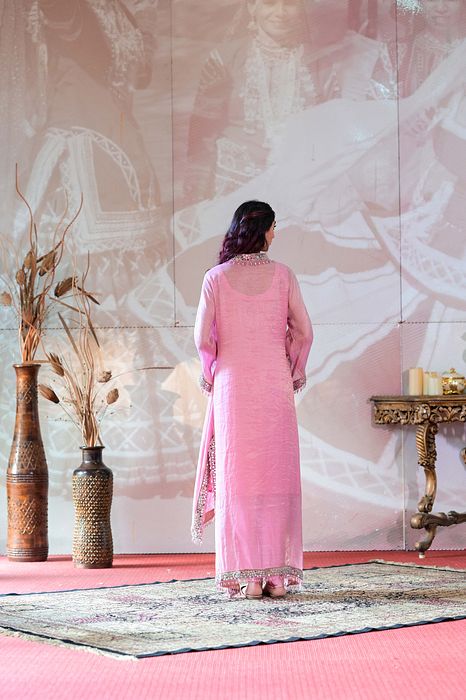 A model showcasing Onion Pink Kaftan Kurta by Farha Syed from Farha Syed's collection