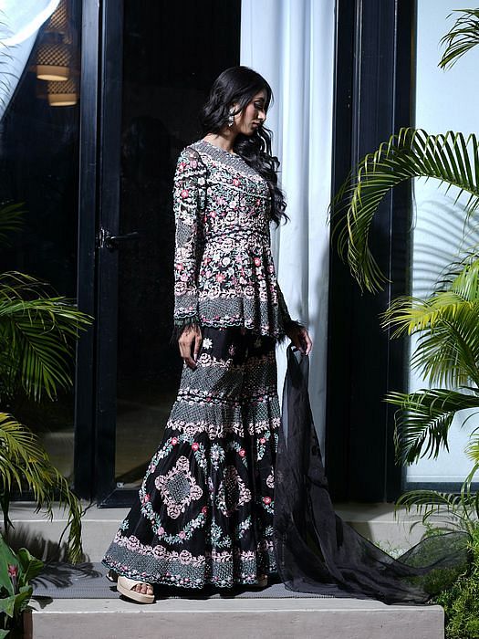 A model showcasing Black Sharara Kurta Set by Farha Syed from Farha Syed's collection