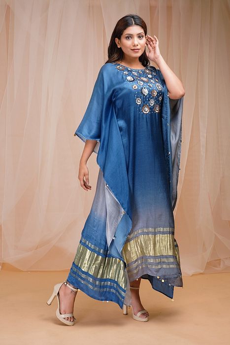 A model showcasing Sapphire Blue Cornflower Blue Shaded Kaftaan by Farha Syed from Farha Syed's collection A model showcasing Sapphire Blue Cornflower Blue Shaded Kaftaan by Farha Syed from Farha Syed's collection