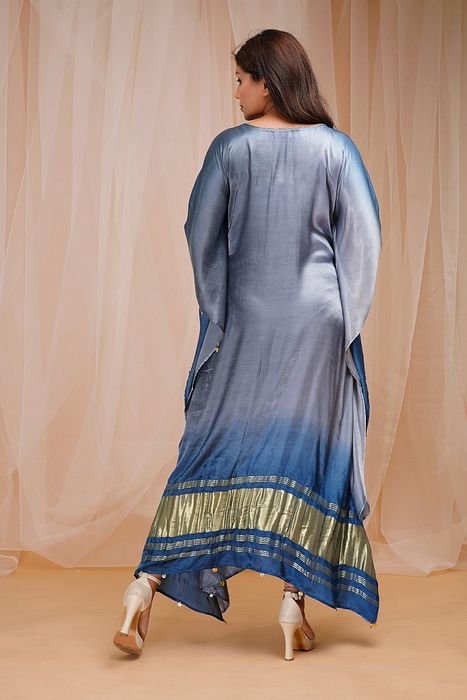 A model showcasing Sapphire Blue Cornflower Blue Shaded Kaftaan by Farha Syed from Farha Syed's collection A model showcasing Sapphire Blue Cornflower Blue Shaded Kaftaan by Farha Syed from Farha Syed's collection